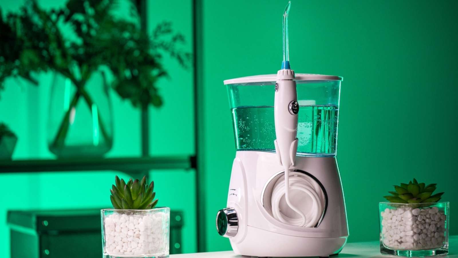 best water flosser reviews - dental water flosser for braces, oral hygiene on a bathroom table